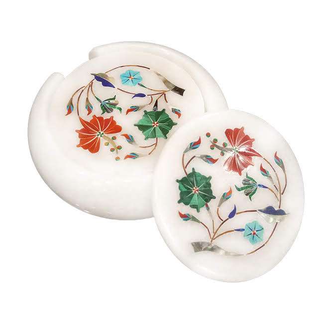 Handcrafted marble coaster with floral stone inlay on wooden table alternate view